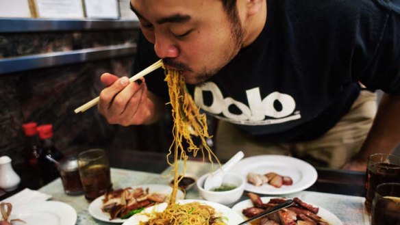 Momofuku's David Chang eating at Great NY Noodletown, New York.