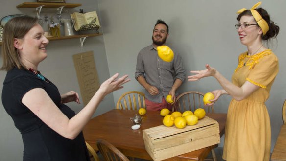 Lady Bower cafe owners Jason Chan and Vanessa Nitsos receive lemons from the garden of regular customer Kate van der Drift.