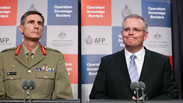 'On-water' matters: General Campbell alongside former immigration minister Scott Morrison in 2014.