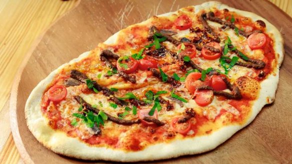 Among the offerings at the Dining Hall is the pizza with anchovy, chilli, olive and cherry tomato.