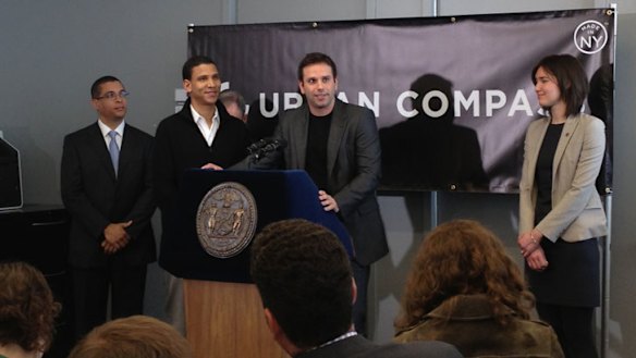 Creating a local network ... Urban Compass co-founder Dr Ori Allon, centre, launches his latest venture in New York.