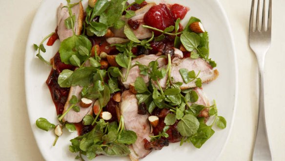Sweet and sour duck salad with plums and almonds.