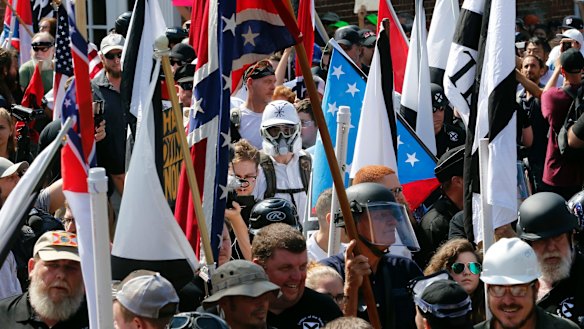 White nationalist demonstrators are surrounded by counter demonstrators in Charlottesville.