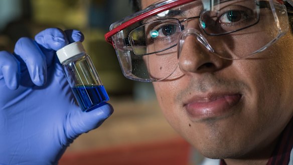Victor García-López holds a vial with millions of single-molecule nano-subs.
