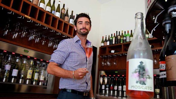 Sweet drop: Remi Pinatel, manager of Wine Odyssey in The Rocks, with a bottle from the wine bar's range of moscatos.