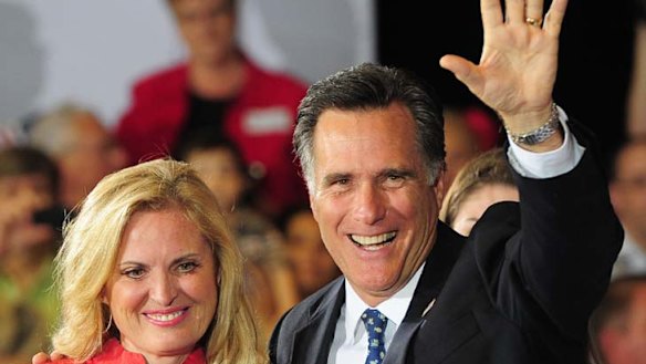 Republican presidential hopeful Mitt Romney and wife Ann celebrate during a primary election night event.