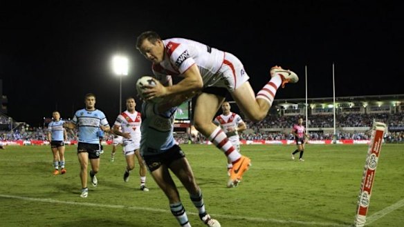 Above and beyond: Dragons speedster Brett Morris flies high against Cronulla.