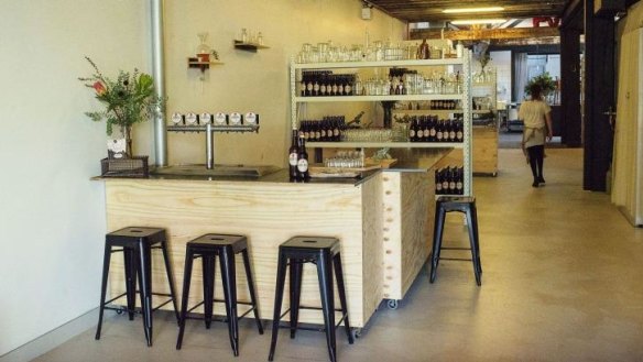The bar area featuring six kombucha taps.