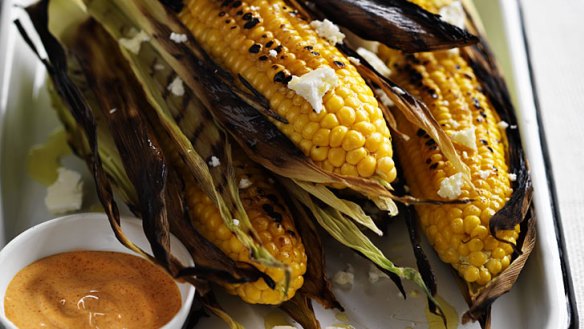 Corn on the cob with cheese and lime