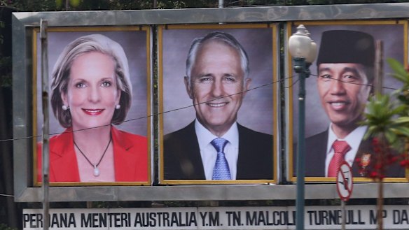 Prime Minister Malcolm Turnbull and his wife Lucy on a billboard with Indonesian President Joko Widodo near the Presidential Palace in Jakarta, Indonesia on Thursday.