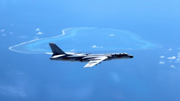 A Chinese H-6K bomber patrols the islands and reefs in the South China Sea. 