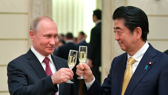 Russian President Vladimir Putin, left, and Japanese Prime Minister Shinzo Abe, toast after an opening ceremony of the cross-cultural year of Russia and Japan at the Bolshoi Theater in Moscow, Russia last week.