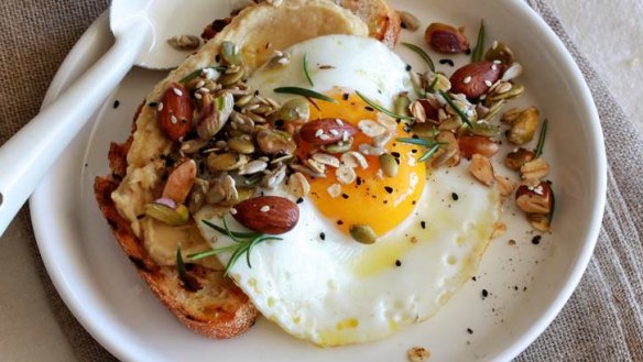 Crunch 'n' fibre: Scatter savoury granola over egg, toast and hommous.