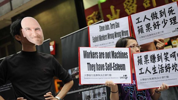 A man posing as Apple CEO Steve Jobs takes part in a protest against Foxconn in Hong Kong.