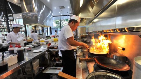 Owner, Jiang Liang, left and chef Dezhi Huang, in the kitchen.