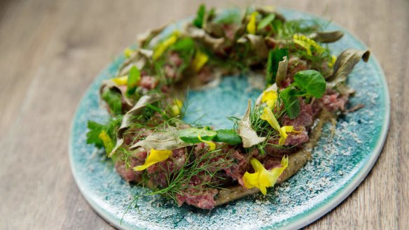 Foraged flowers garnish the beef tartare.