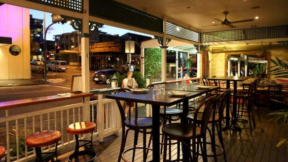 Gaslight Bistro's verandah is dotted with potted palms.