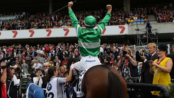 Golden moment: Hugh Bowman wins The BMW with  Fiveandahalfstar on Golden Slipper day in April.