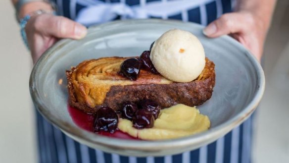 The kouign-amann's sugary richmess is cut by lemon curd and cherries.
