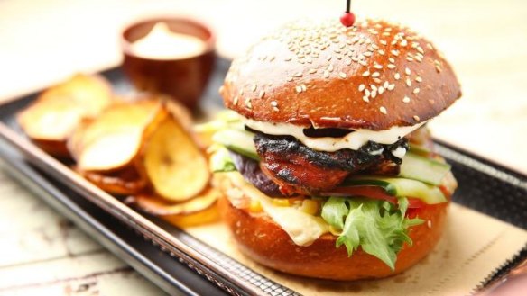 The Jamaican jerk chicken burger served with plantain chips.