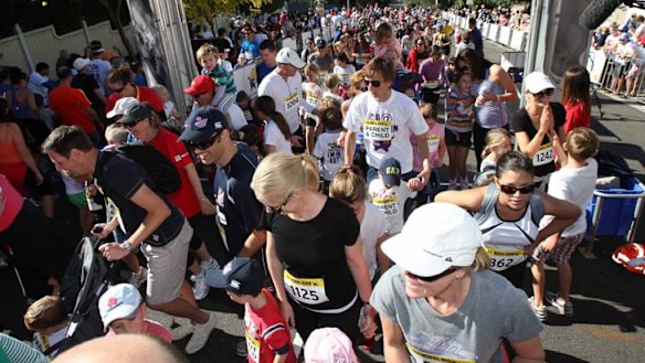Crossing the line ... runners finish the parent and child event.