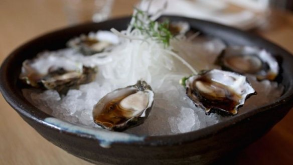 A half dozen Wallis Lake Sydney rock oysters on ice.