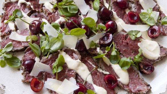 Beef carpaccio with horseradish cream, remoulade and pickled cherries.