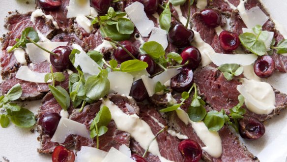 Beef carpaccio with horseradish cream, remoulade and pickled cherries.