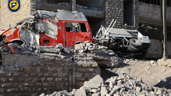 Destroyed ambulances are seen outside the Syrian Civil Defence main center after airstrikes in Ansari neighborhood in the rebel-held part of eastern Aleppo, Syria.