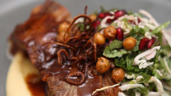 Slow-cooked lamb shoulder with pomegranate, sorrel and a lush chickpea puree.