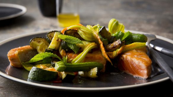 Pan-fried salmon with fried zucchini, zucchini flowers, chilli and mint.