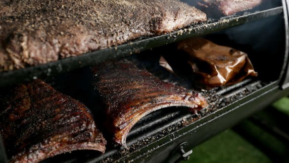 Steak and ribs in the smoker at Bluebonnet Barbecue.