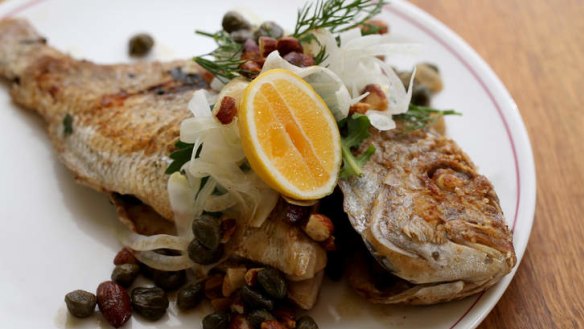 Whole baby snapper receives a light touch.