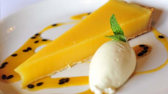 Lemon tart with passionfruit and clotted cream.