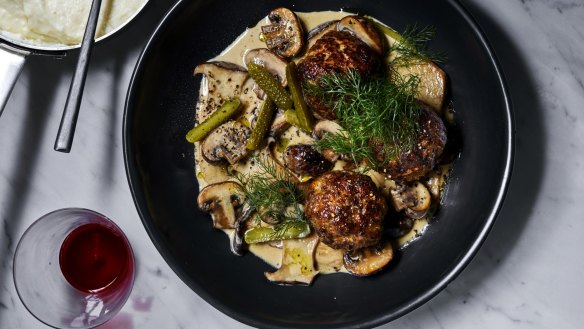 Meatball stroganoff with semolina and cornichons.  