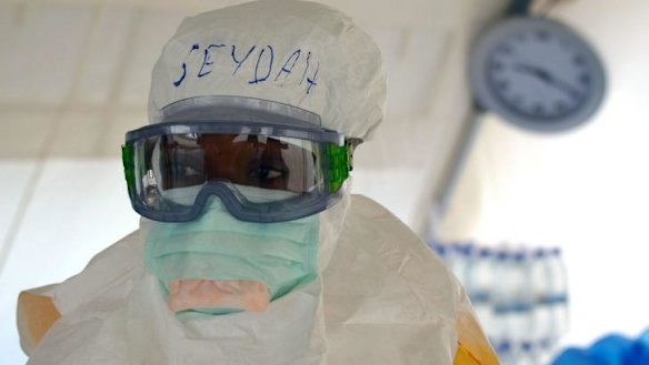 A Liberian health worker helps at the Medecins Sans Frontieres (Doctors Without Borders) Ebola treatment centre in Monrovia, Liberia.