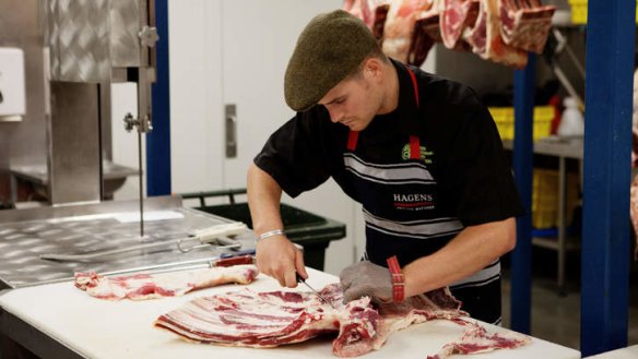 Scott Rogers works on a carcass.