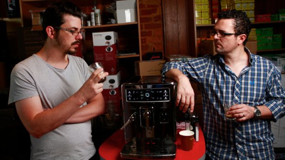Baristas Craig Simon (left) and Dave Makin sample espresso from the Saeco Xelsis ID.