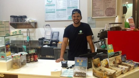 Manager and co-owner of Nutrition Station Aidan Gordon behind the counter of the Canberra store.