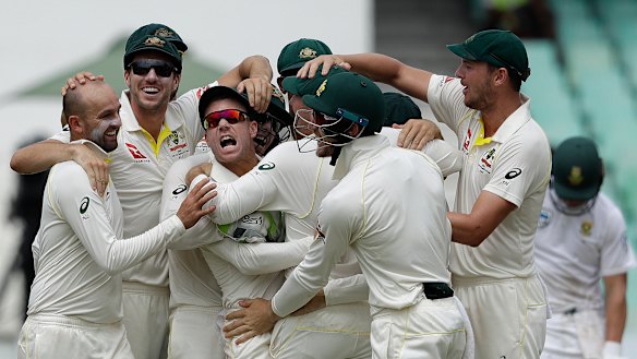Tirade: David Warner is mobbed by teammates after the run out of  AB de Villiers for a duck.