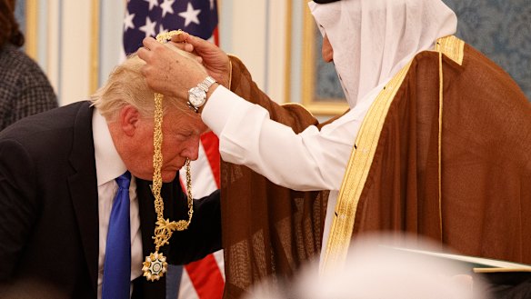 Saudi King Salman presents President Donald Trump with The Collar of Abdulaziz Al-Saud Medal at the Royal Court Palace last year.