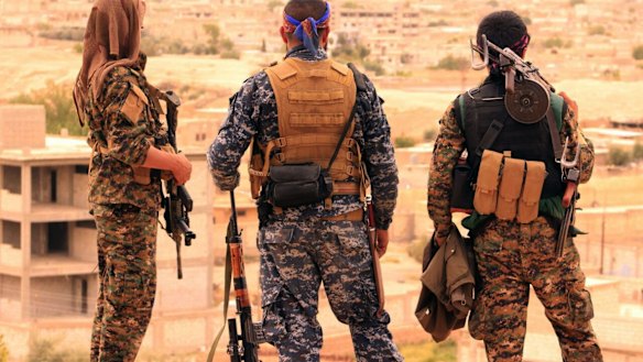 Fighters from the Syrian Democratic Forces looking toward the northern town of Tabqa, Syria. US-backed Syrian forces have launched their attack on the Islamic State group's de facto capital of Raqqa, in northern Syria.