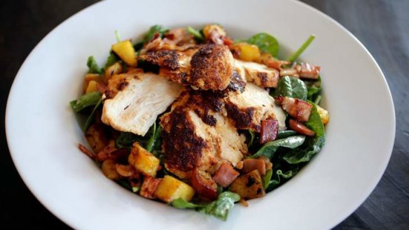 Inclusive: Entice's allergy-aware menu includes paprika chicken over a baby spinach salad.
