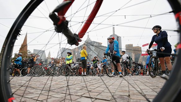 Hundreds of bicycle riders leave Federation Square for the Mike Hall tribute ride after he was killed near Canberra on the Indian Pacific Wheel Ride.