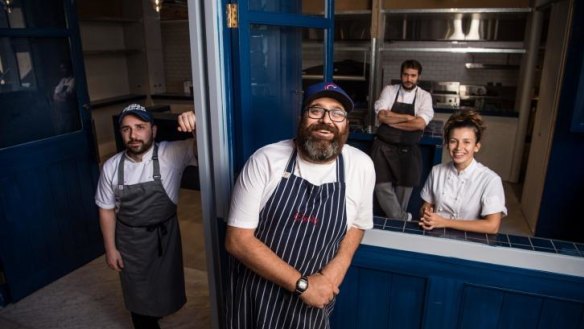 Somer Sivriouglu with his three chefs.