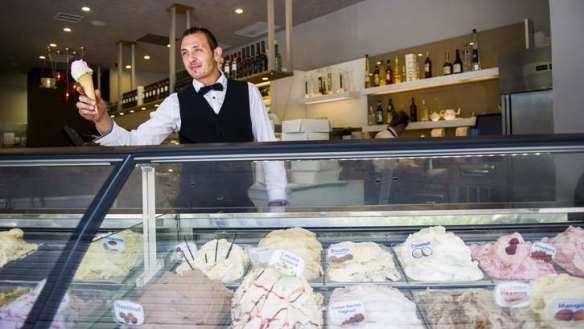 Dolce and Salato manager Marco Marzotto with a gelato at the shop in Garema place.