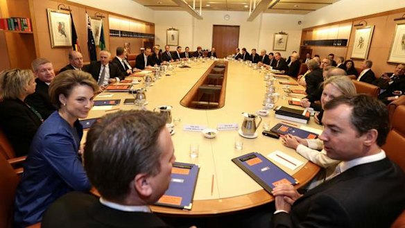 Prime Minister Tony Abbott meets with his ministry in the cabinet room at Parliament House in Canberra on Wednesday.