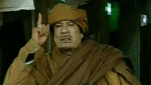 Defiant ... Moammar Gaddafi.