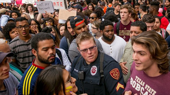 Protester Patricia Romo, left, 22, argues with Trump supporter Cody Williams, 18, during a demonstration at Texas State University in San Marcos.