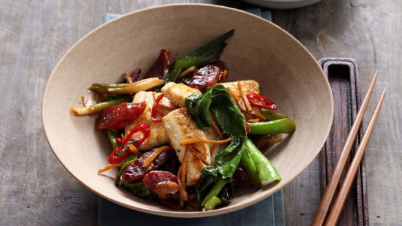 Wok-fried fish with lap cheong, chilli and ginger.